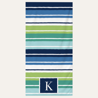 Personalized striped beach towel with custom monogram letter design for beach and pool use