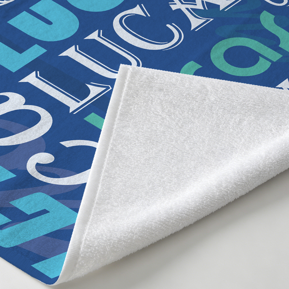 Personalized name collage beach towel showing soft microfiber fabric texture and smooth towel surface