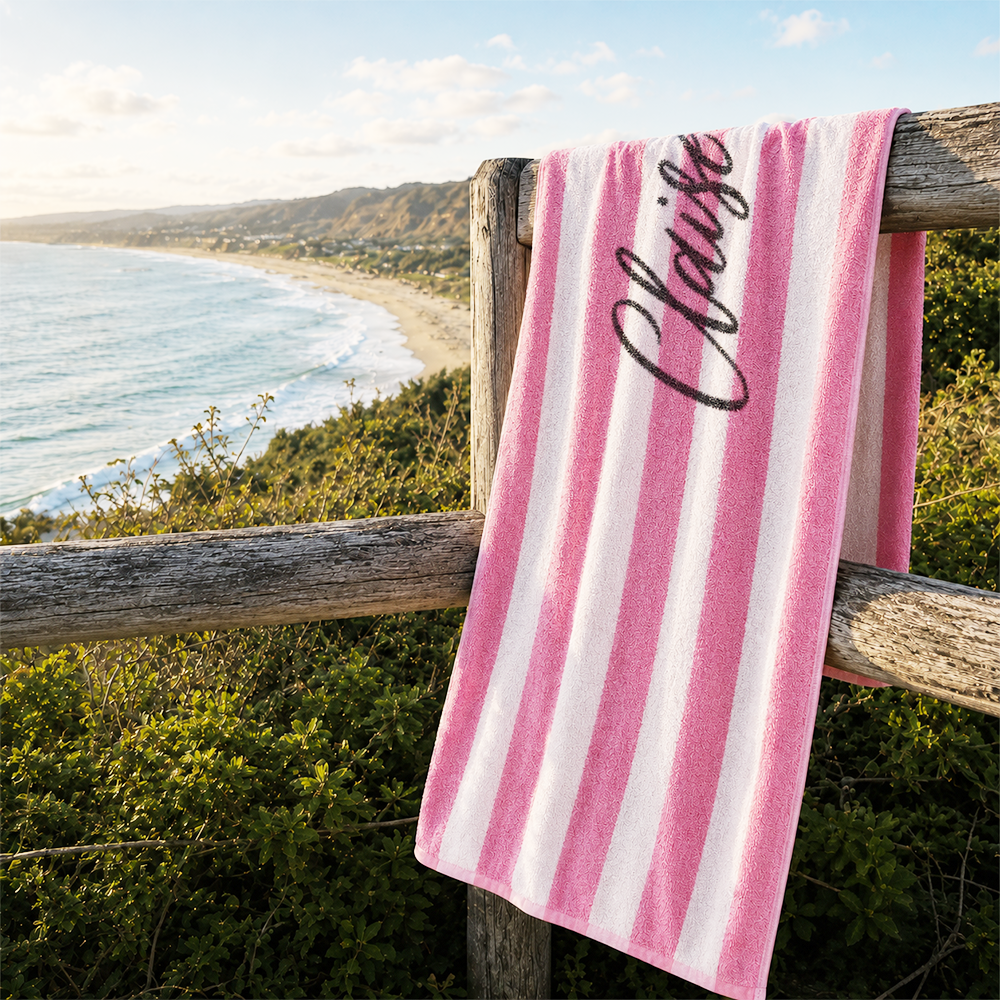 Custom striped beach towel featuring personalized name print for beach and pool activities