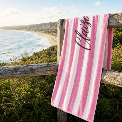 Custom striped beach towel featuring personalized name print for beach and pool activities