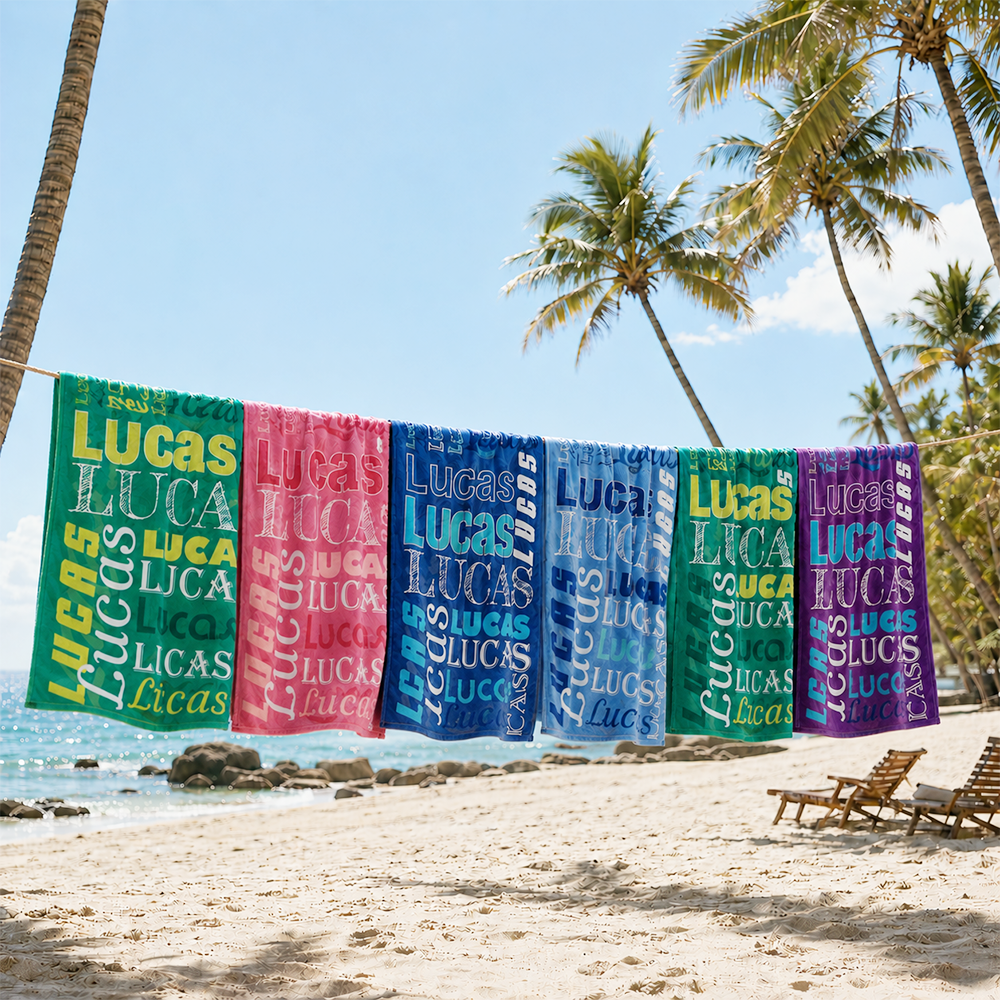 Custom personalized name collage towel displayed on the beach with colorful printed design