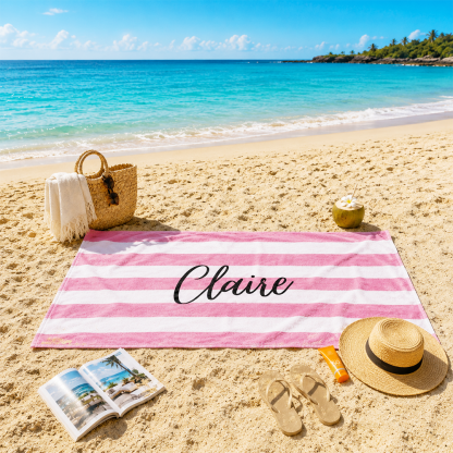 Custom name striped beach towel displayed on the beach for personalized summer vacation accessories