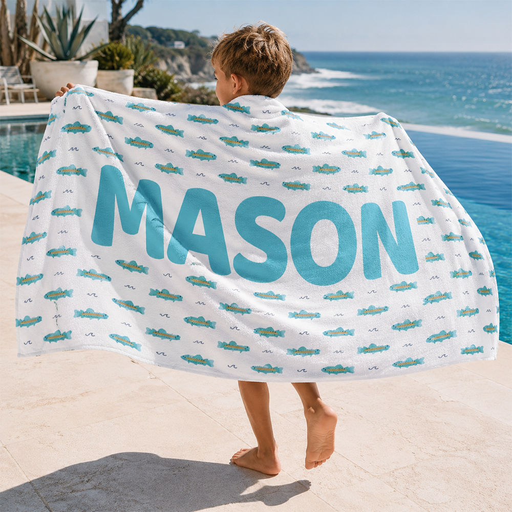 Custom name kids beach towel used by children at the beach for summer vacations and outdoor activities