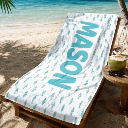 Custom personalized kids beach towel displayed at a poolside lounge for summer beach vacations