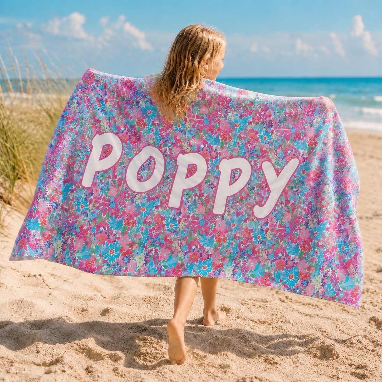Custom name kids beach towel used by children at the beach for summer vacations and outdoor activities