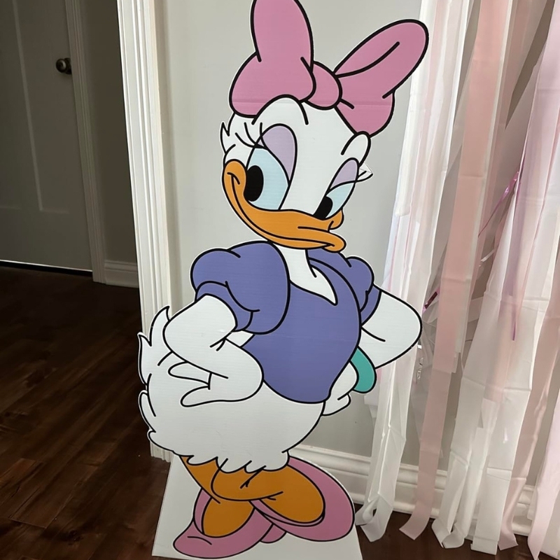 Daisy Duck Disney character life-size cardboard cutout standing indoors