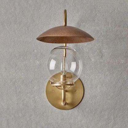 Applique murale Mia en laiton satiné et bronze, abat-jour boule en verre