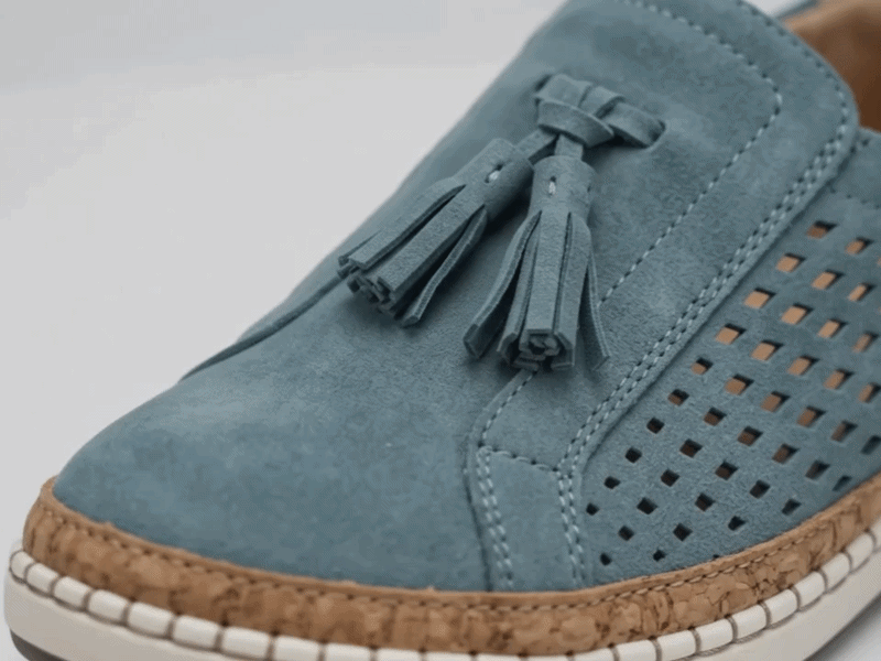 Suggested image: macro close-up of the hollow-out perforated upper showing breathable airflow holes, soft faux leather or suede-texture surface, and neat stitching details