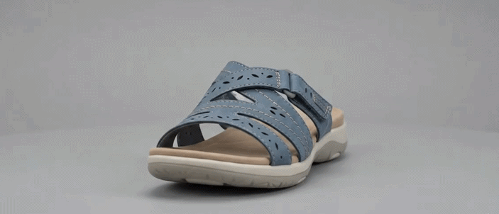 GIF showing a womasupportive flan removing unt summer shoes after walking