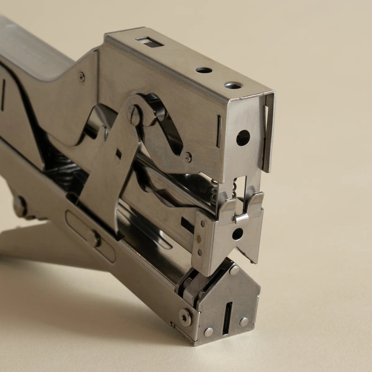 Portable and compact corner nail gun