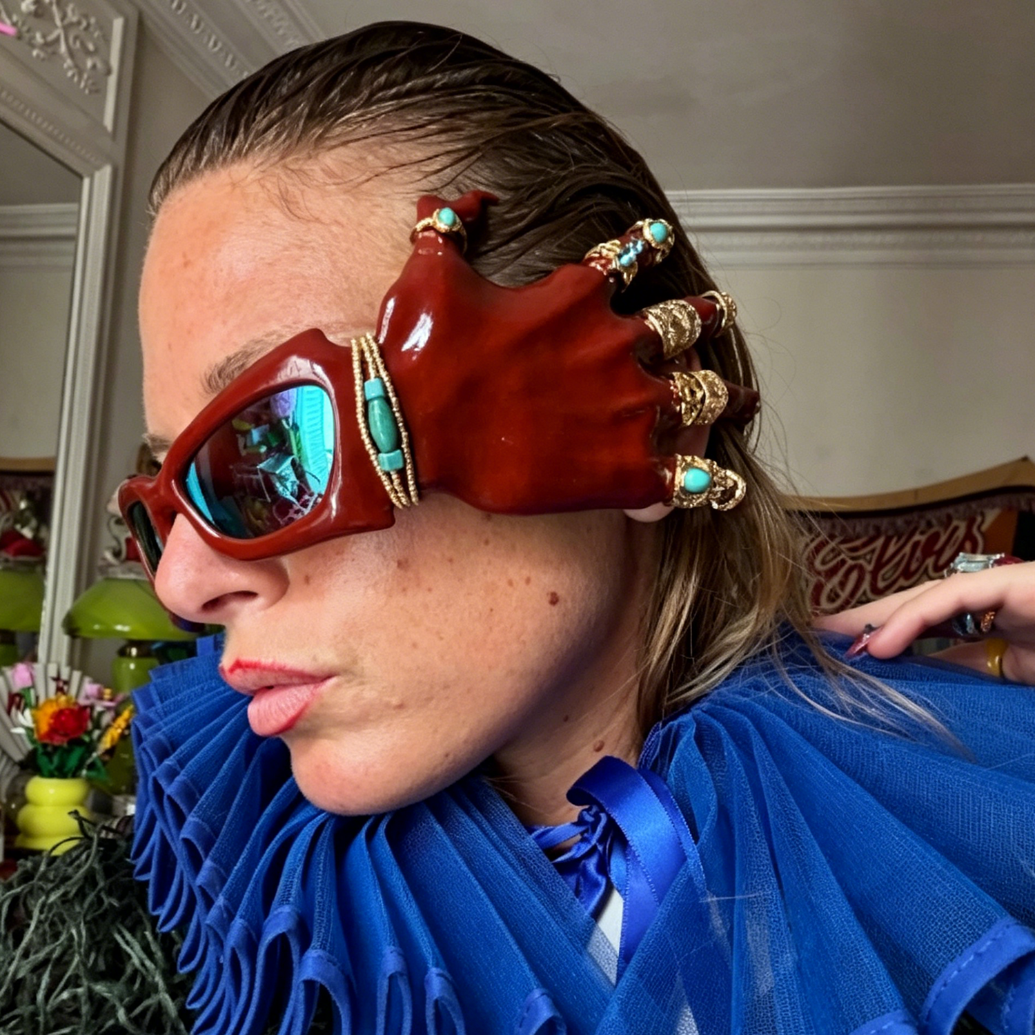 3D-printed red hand-shaped sunglasses