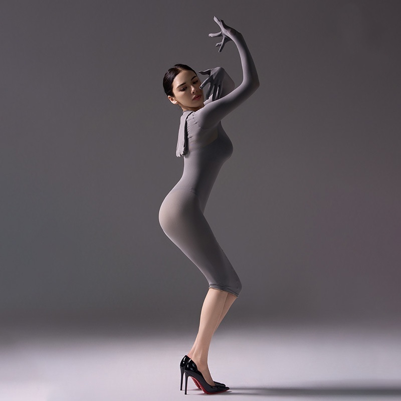 Mysterious, form-fitting, bodycon dress.