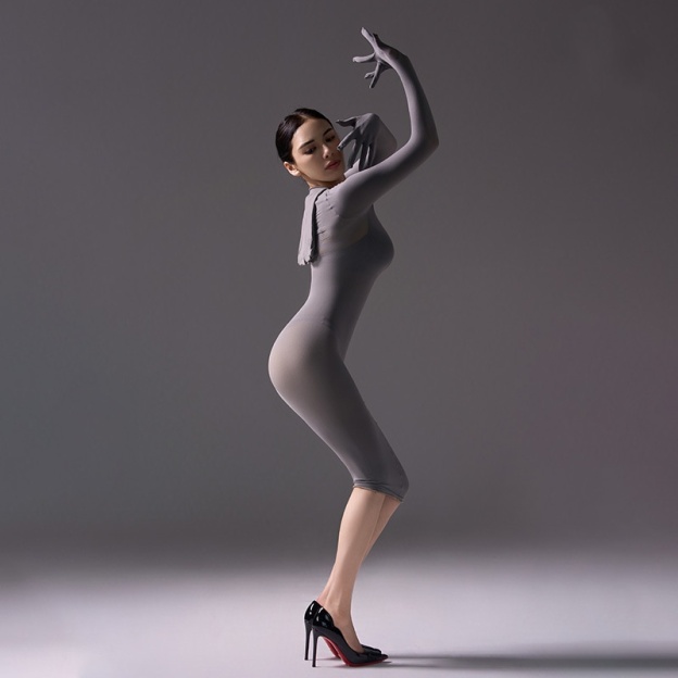 Mysterious, form-fitting, bodycon dress.