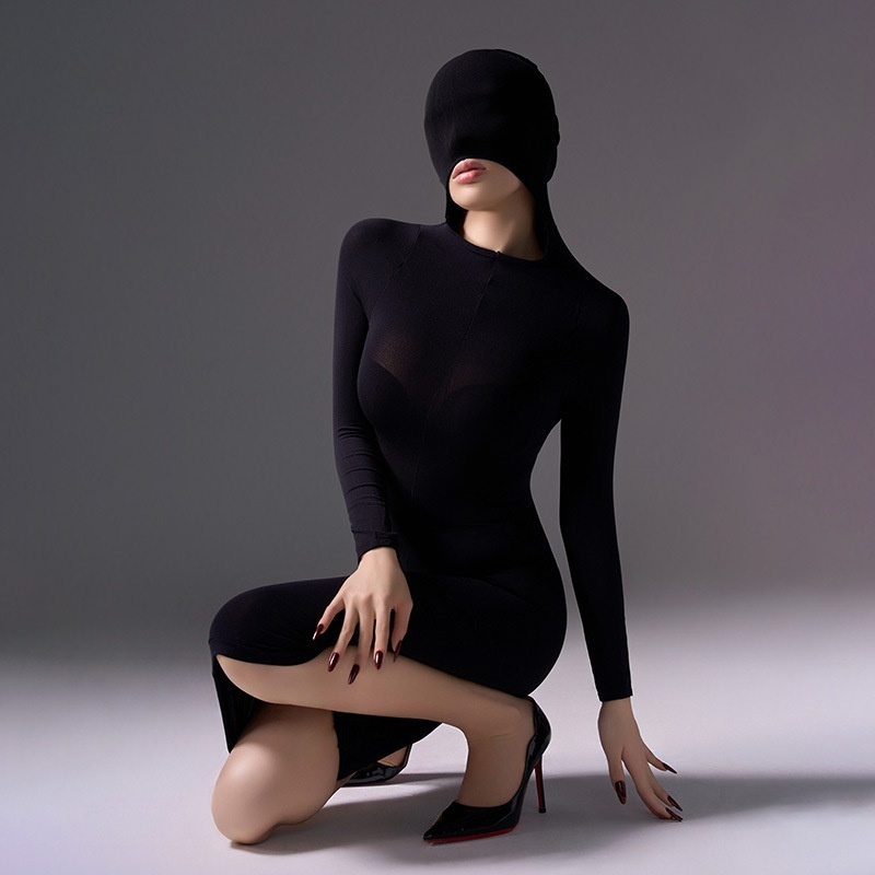 Mysterious, form-fitting, bodycon dress.