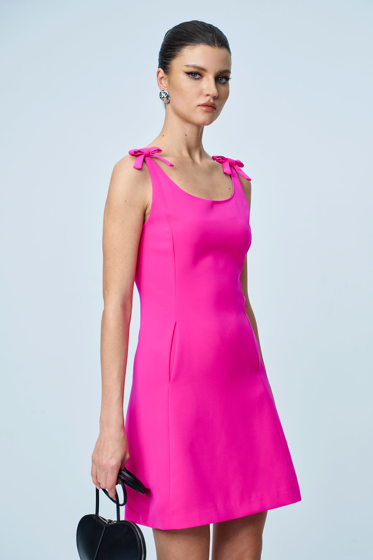 Amaziah Bow Sleeveless Mini Dress