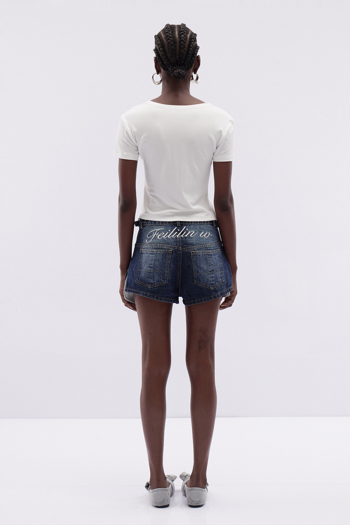 Itimad Asymmetric Button Denim Shorts