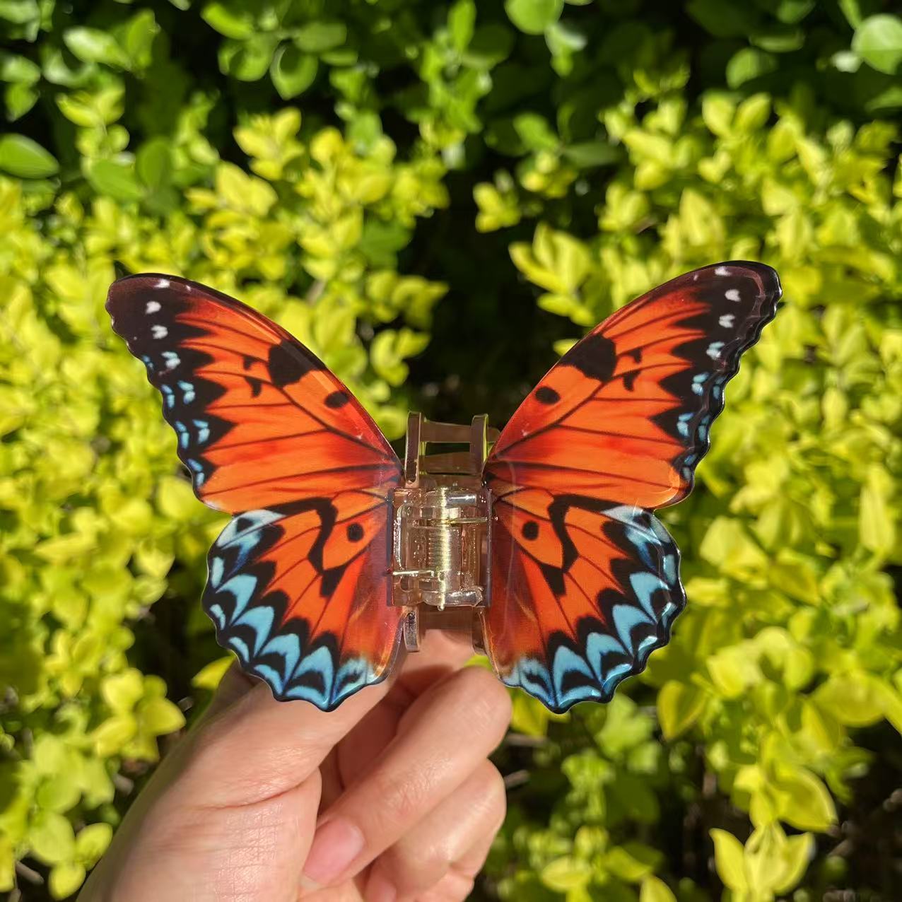 Vanessa butterfly hair claw in Orange