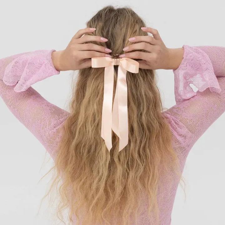 Bow-shaped magnetic hair clip