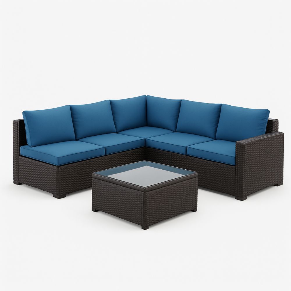 Udendørs lounge hjørnesofa med blå hynder og glasbord i rattan-decovivapt