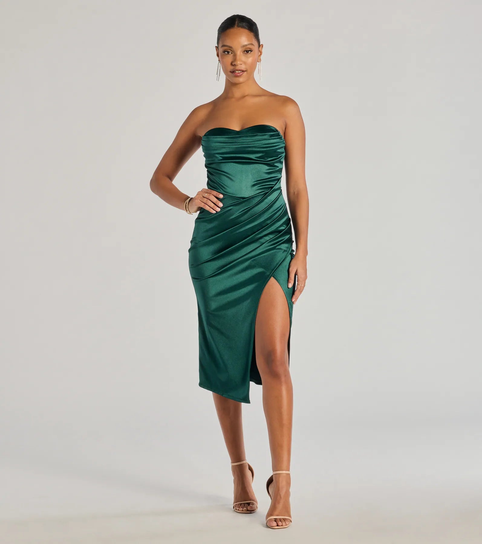 The Kaleen Sleeveless Satin Wrap Midi Dress is a hunter green midi dress, featuring an elevated midi-length silhouette perfect for wedding guest attire, romantic date nights, or effortless everyday styling.
