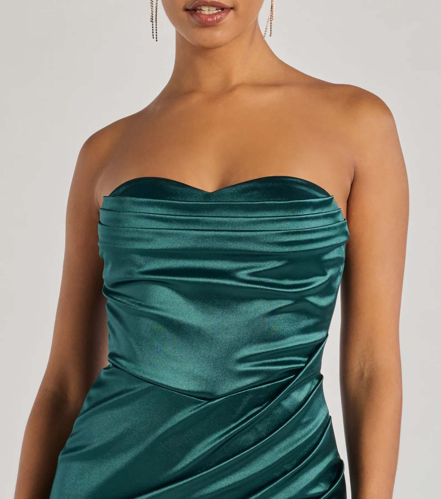 Make a bold statement in the Kaleen Sleeveless Satin Wrap Midi Dress in hunter green, the perfect green dress for weddings, cocktail hours, nights out, and/or seasonal celebrations.