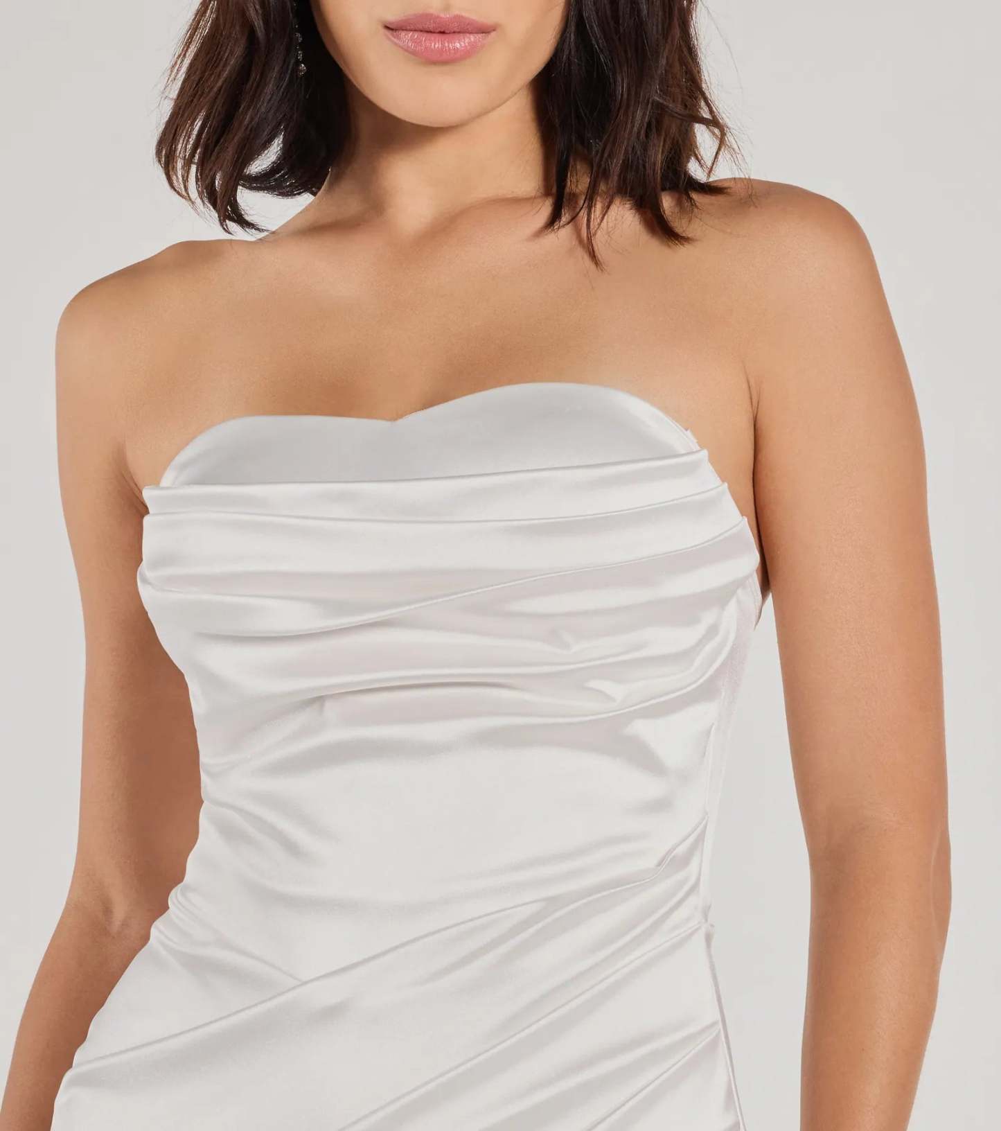 Make a bold statement in the Kaleen Sleeveless Satin Wrap Midi Dress in white, the perfect dress for Prom 2026, formal wedding guest attire, or military ball.