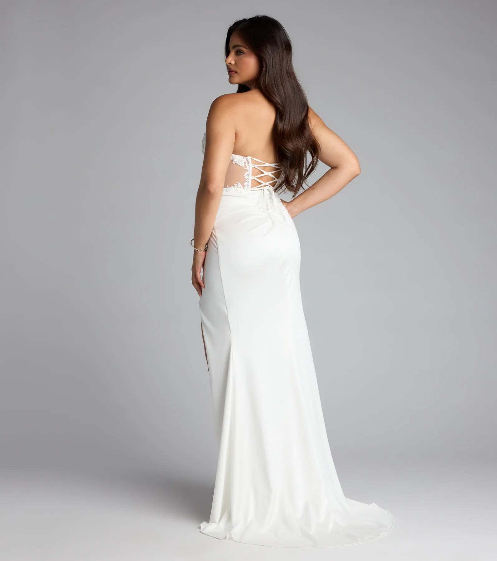 A stunning pick for an engagement photoshoot outfit or wedding guest dress, this formal dress showcases the Shayla Strapless Corset Lace Formal Dress in ivory with a graceful silhouette that captures the moment.