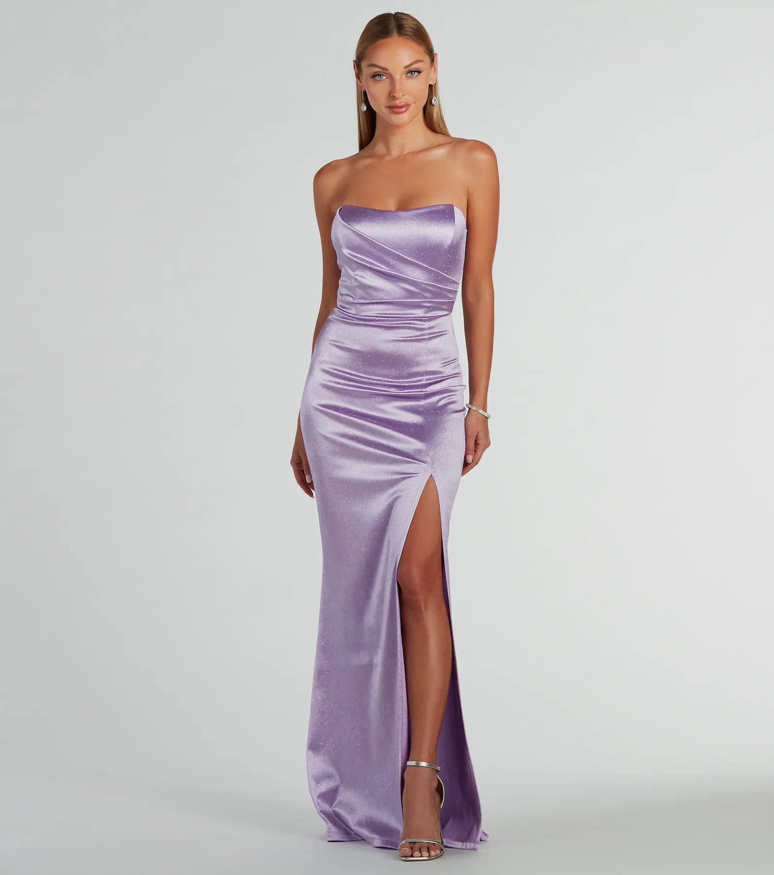 Add royal flair with the Aliyah Strapless Mermaid Satin Glitter Dress in lavender, a viral-worthy pick from the purple homecoming dress collection made to light up your HOCO feed.