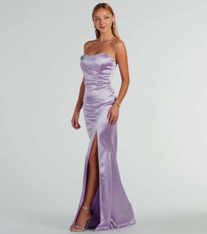 A stunning pick for an engagement photoshoot outfit or winter wedding guest dress, this glitter formal dress showcases the Aliyah Strapless Mermaid Satin Glitter Dress in lavender with a graceful silhouette that captures the moment.