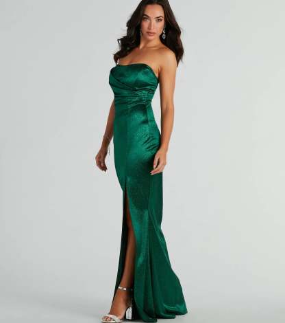 A stunning pick for an engagement photoshoot outfit or winter wedding guest dress, this glitter formal dress showcases the Aliyah Strapless Mermaid Satin Glitter Dress in hunter green with a graceful silhouette that captures the moment.