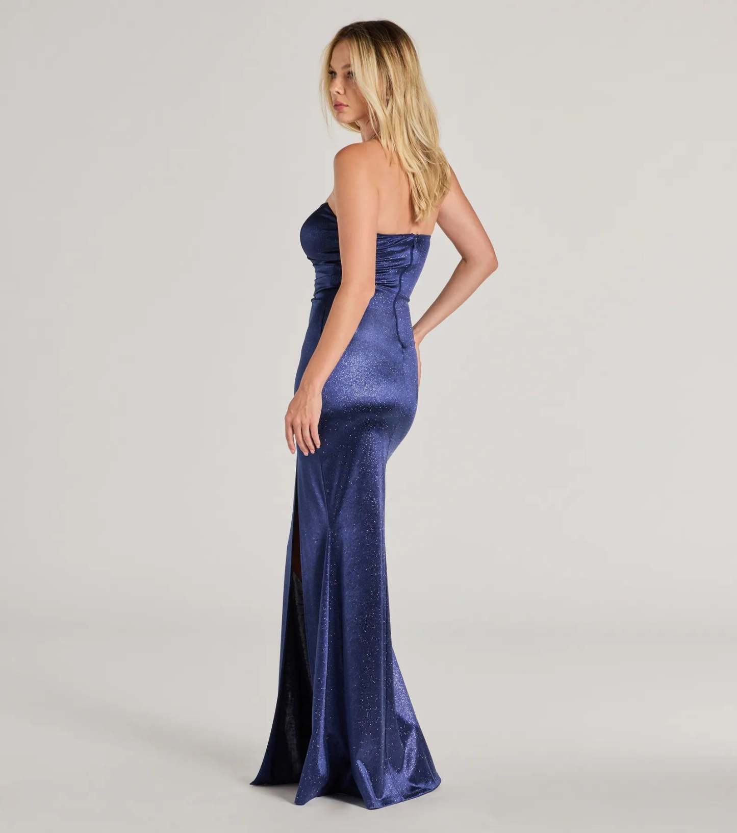 Own your moment in the Aliyah Strapless Mermaid Satin Glitter Dressin navy blue, a standout quinceanera guest or Homecoming Dress that captures all the glam and energy of the night.