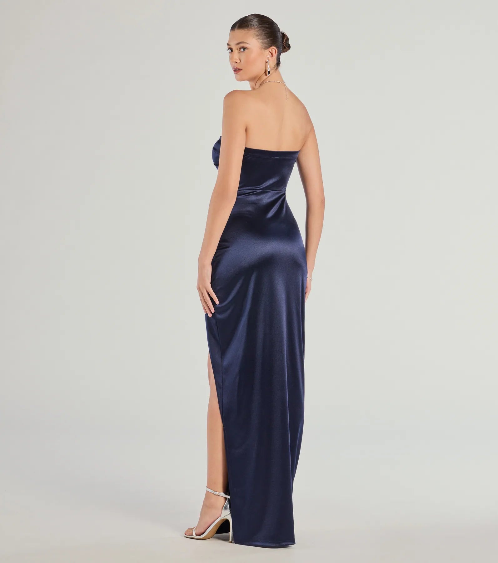 The elegant Lauren Strapless Wrap Slim Satin Formal Dress is a navy blue satin bridesmaid dress crafted with luxe fabric, ideal for modern weddings and traditional bridal parties.