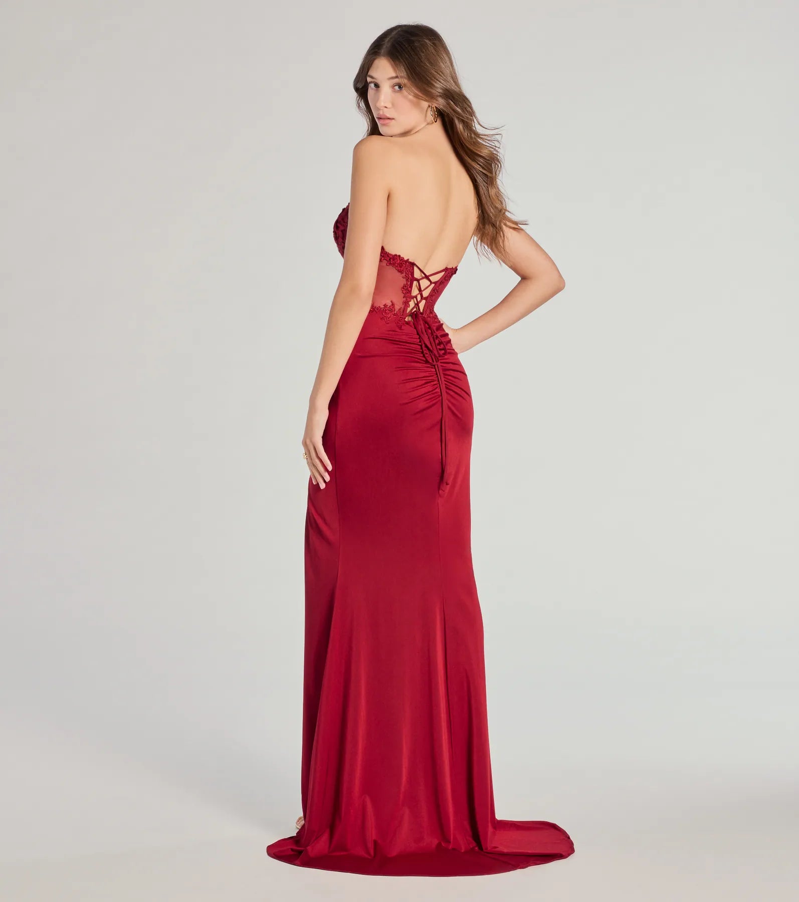 Own every entrance in the Shayla Strapless Corset Lace Formal Dress, a red party dress perfect for milestone birthdays and grad parties, or dancing through Prom nights and unforgettable bachelorette celebrations.