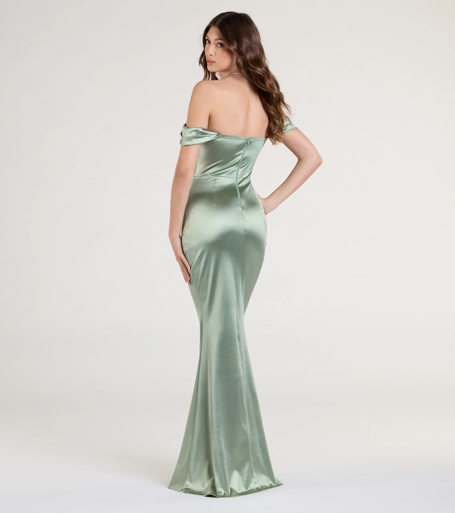 Turn heads at Prom 2026 in this sage green prom dress, where statement-making details meet the iconic style of the Belinda Off-The-Shoulder Slit Satin Formal Dress.