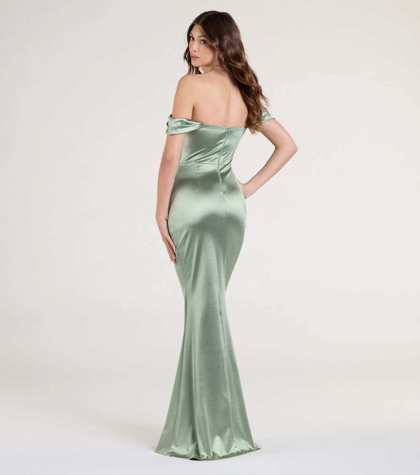 Turn heads at Prom 2026 in this sage green prom dress, where statement-making details meet the iconic style of the Belinda Off-The-Shoulder Slit Satin Formal Dress.