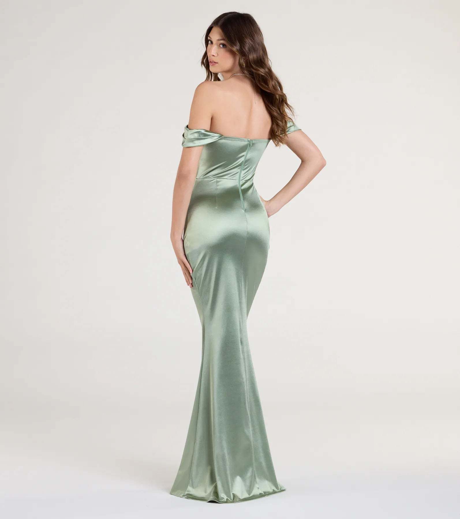 Turn heads at Prom 2026 in this sage green prom dress, where statement-making details meet the iconic style of the Belinda Off-The-Shoulder Slit Satin Formal Dress.