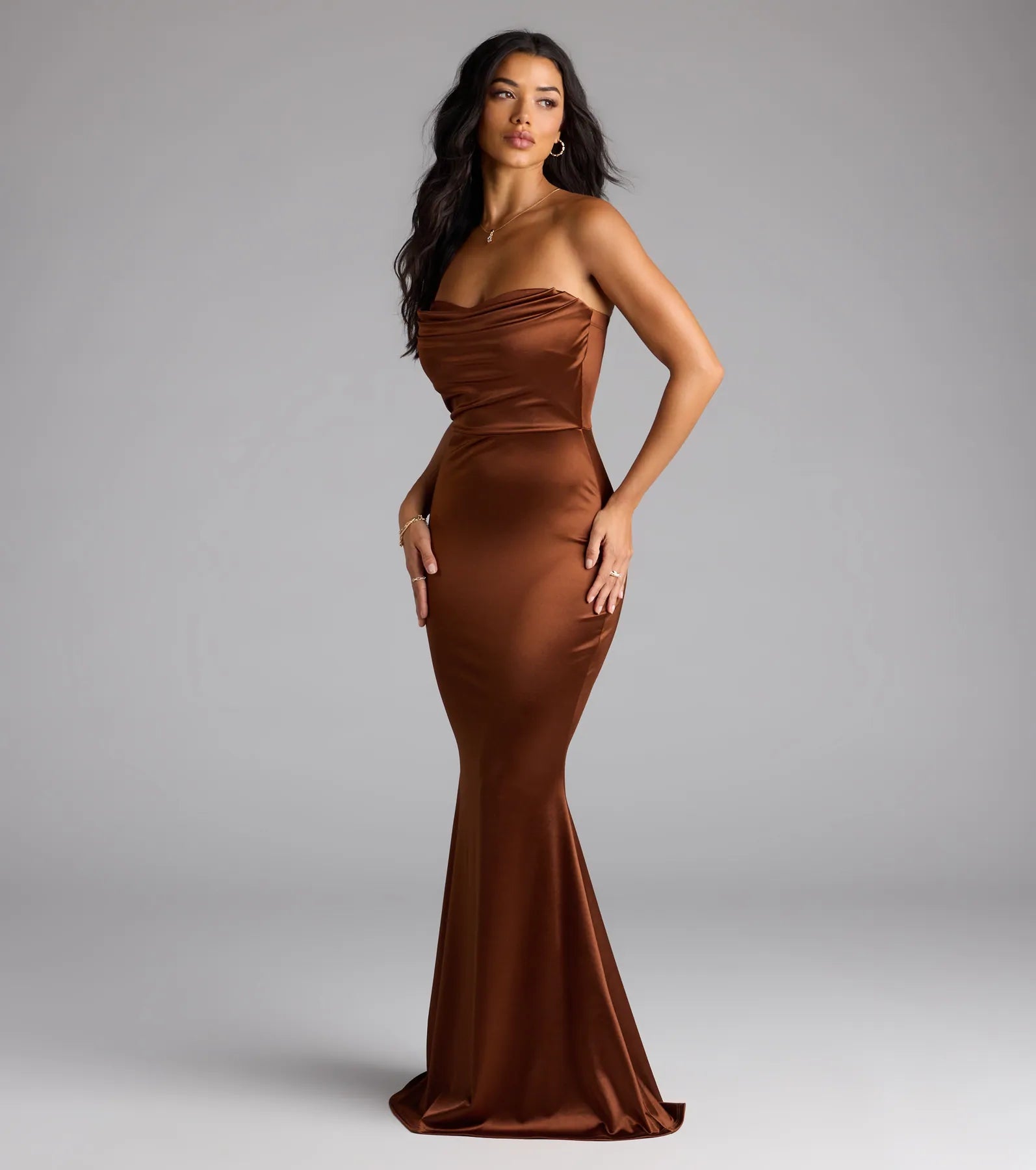 Step into the new season looking effortlessly chic in the Priscilla Formal Satin Strapless Mermaid Dress in brown, a must-have Windsor dress for your cool-weather wardrobe.