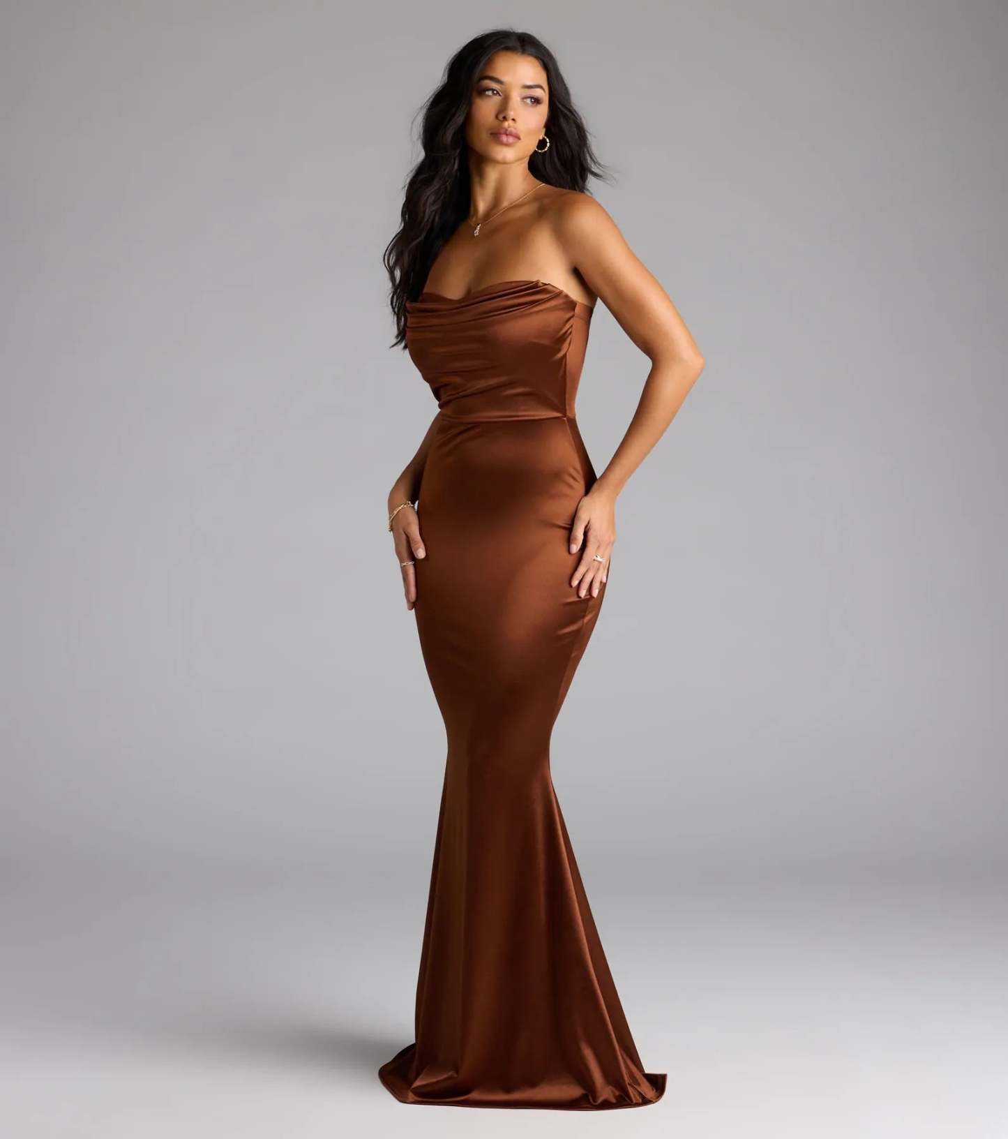 Step into the new season looking effortlessly chic in the Priscilla Formal Satin Strapless Mermaid Dress in brown, a must-have Windsor dress for your cool-weather wardrobe.
