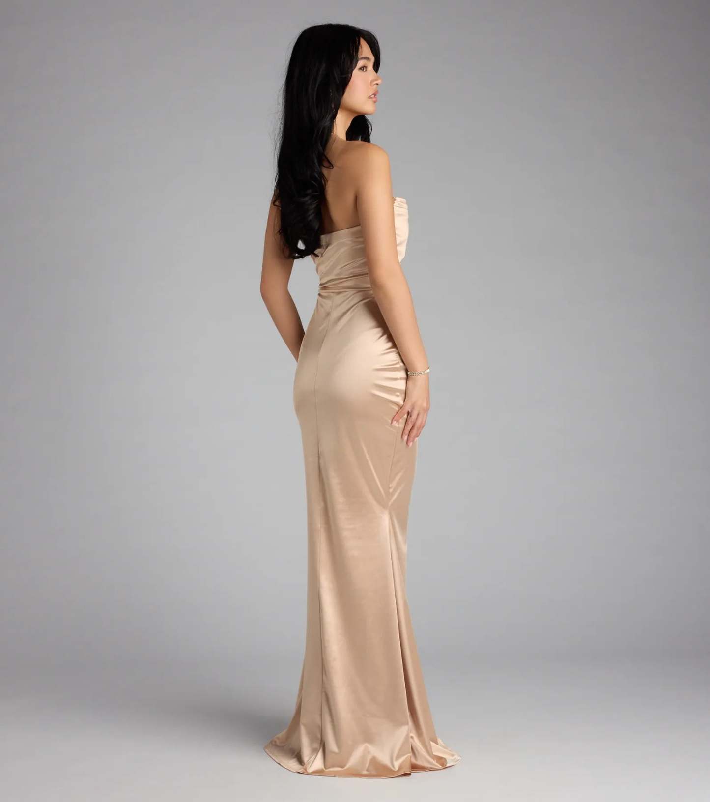 The Priscilla Formal Satin Strapless Mermaid Dress is a taupe prom dress that blends trend-forward design with a flattering fit, perfect for celebrating your night with confidence.