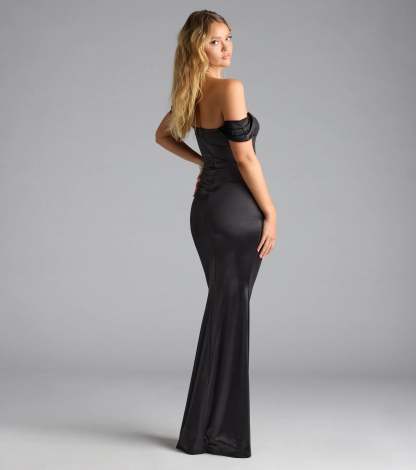 Own the spotlight in the Belinda Off-The-Shoulder Slit Satin Formal Dress, a black formal dress crafted to deliver luxe style for weddings, Military Balls, or Prom 2026.