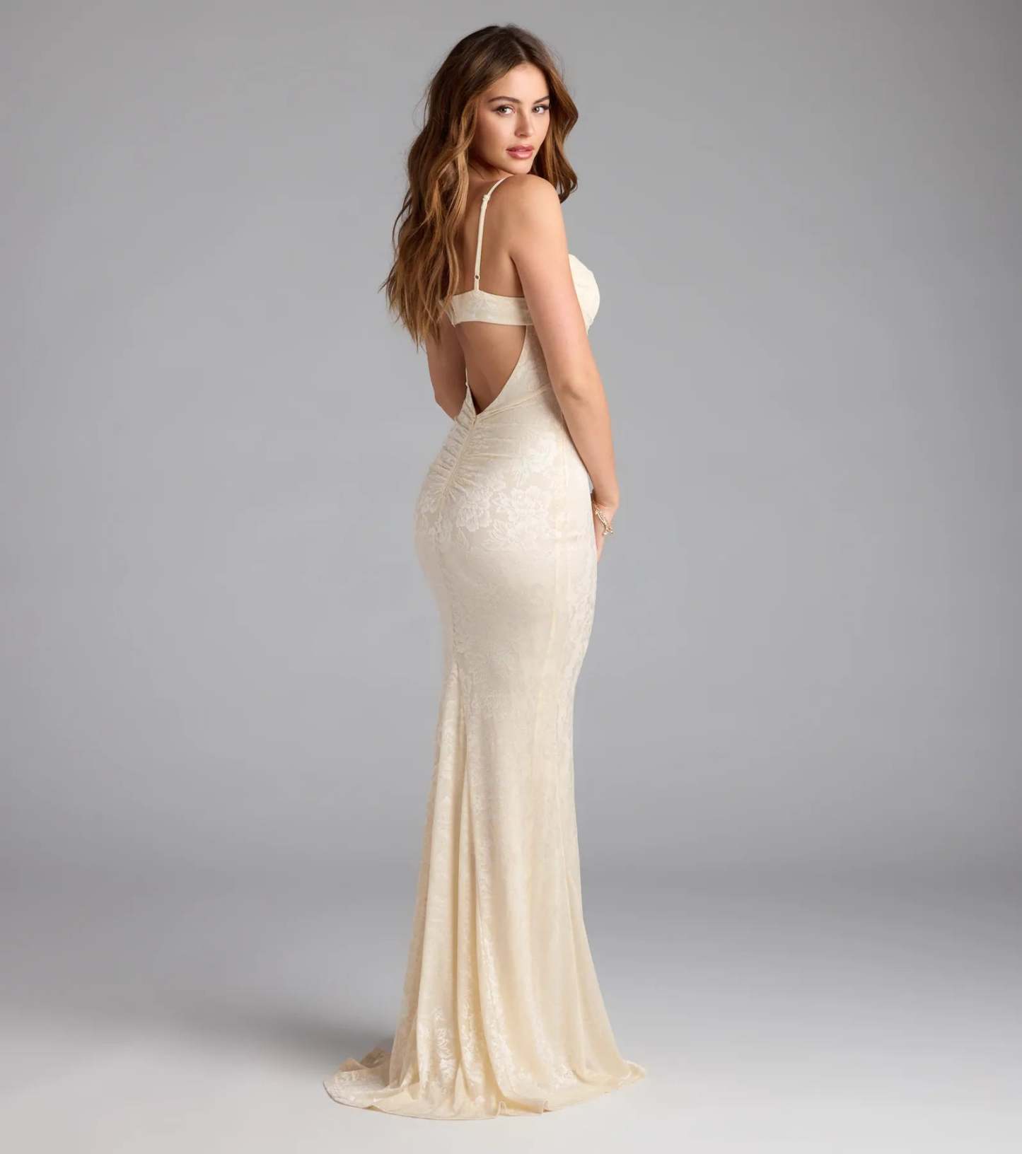Own the spotlight in the Haisley Open Back Floral Lace Mermaid Dress, a ivory formal dress crafted to deliver luxe style for winter weddings, Military Balls, or any special event.