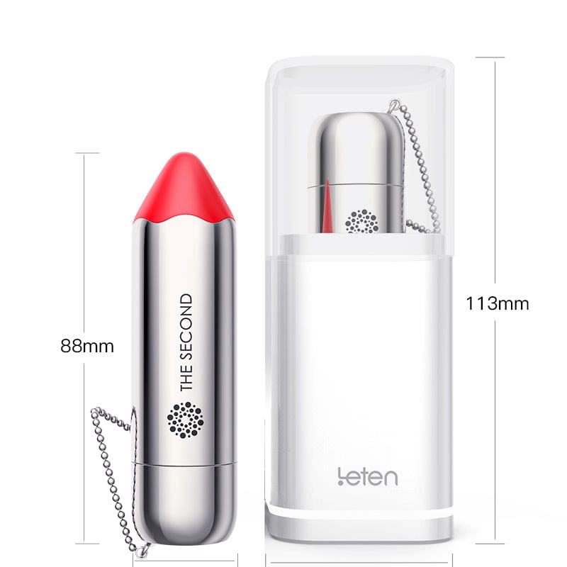 Compact lipstick vibrator with sleek silver design on charging dock