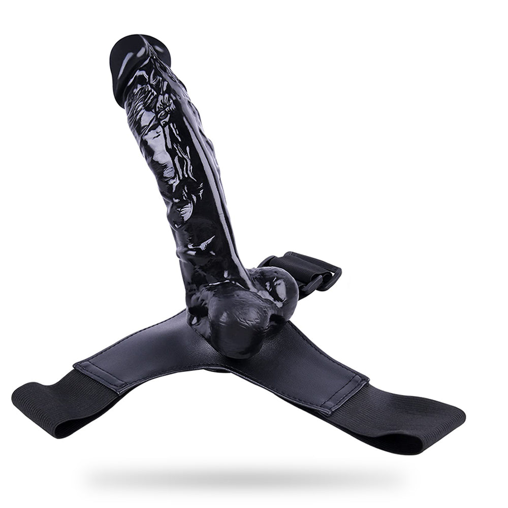 Leather strap dildo showing adjustable harness and realistic design