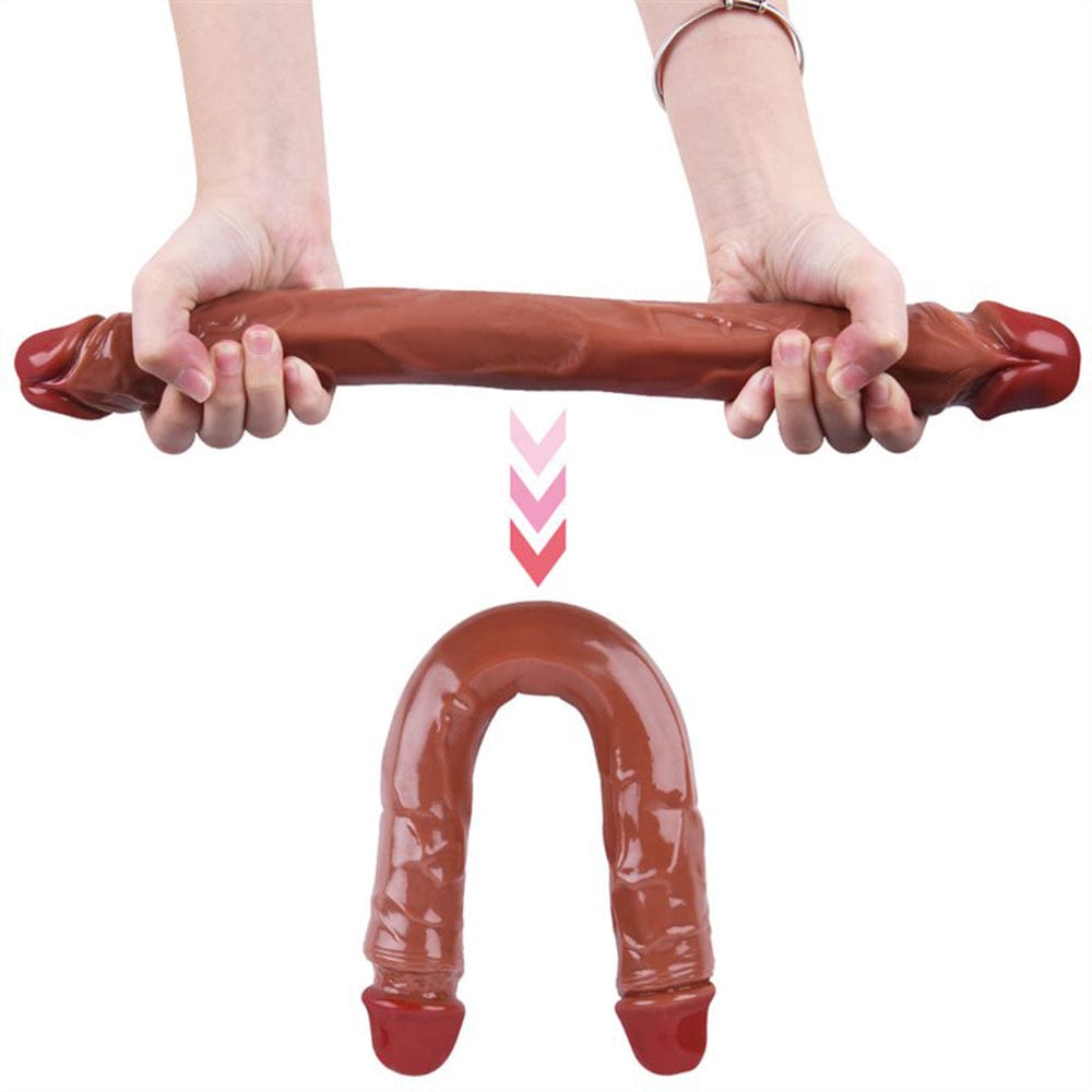 15.55-inch dildo displayed next to measurement tape showing full length