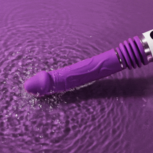 Purple thrusting dildo machine showing ergonomic handle and suction base