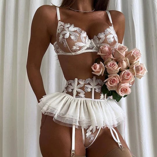 Three-piece embroidered lingerie set front view showing delicate sheer mesh design