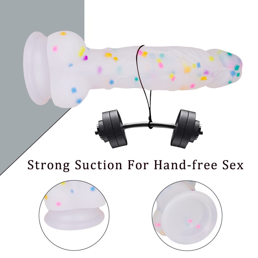 Clear silicone dildo with strong suction cup base attached to surface