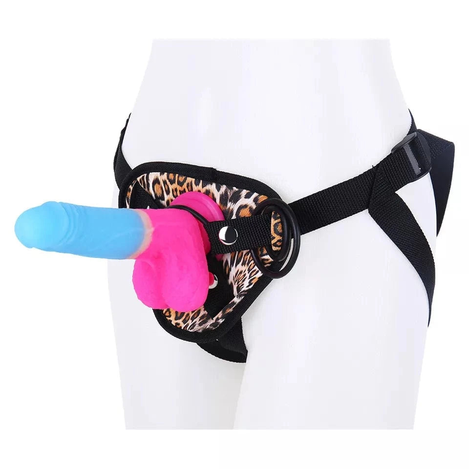 Leopard print strap-on harness with realistic dildo from front angle