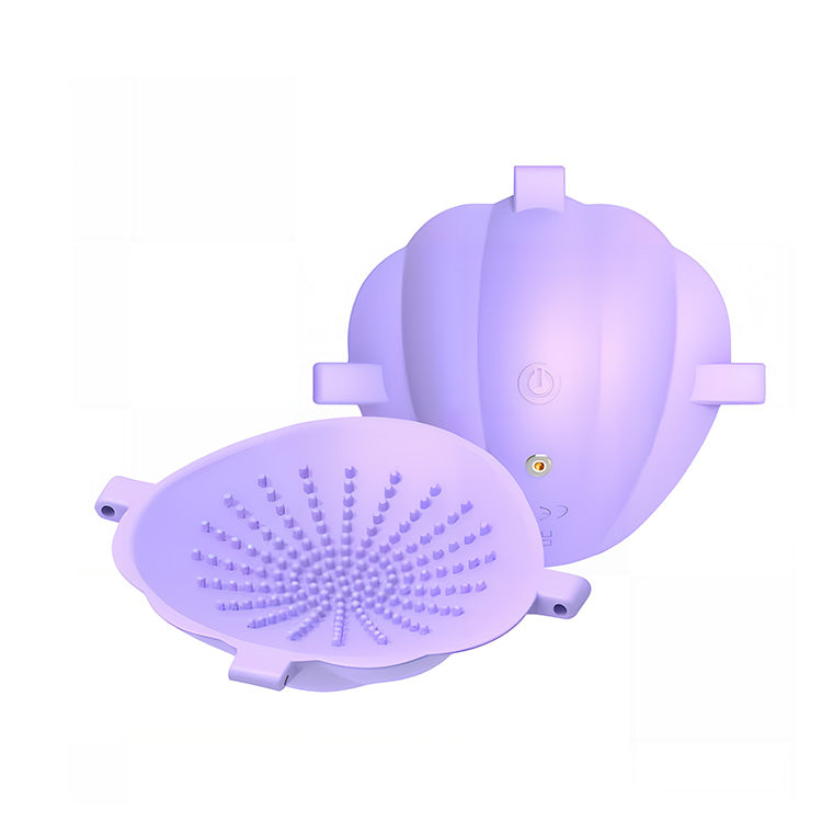 Wearable shell-design nipple vibrator showing adjustable straps and ergonomic fit