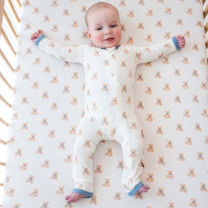 Baby wearing Zippered Romper in Teddy Bear in crib